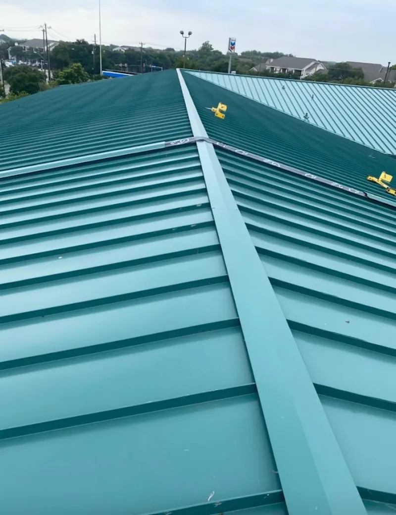 Green commercial metal roof ridge and valley for Metal Roof Repair in Kosciusko
